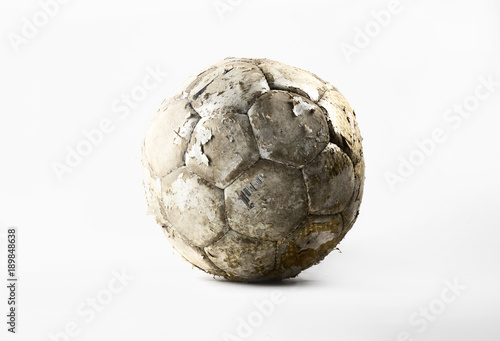 Damaged soccer ball isolated on white background