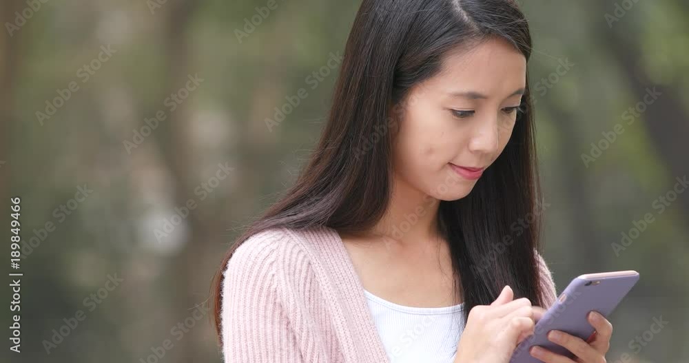 Young woman using mobile phone at outdoor Young woman using mobile phone at outdoor