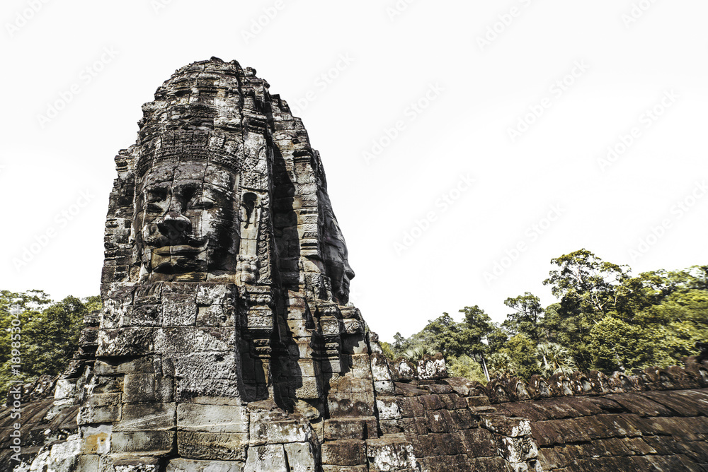 Fototapeta premium Bayon temple faces view isolated on white background, Angkor, Cambodia