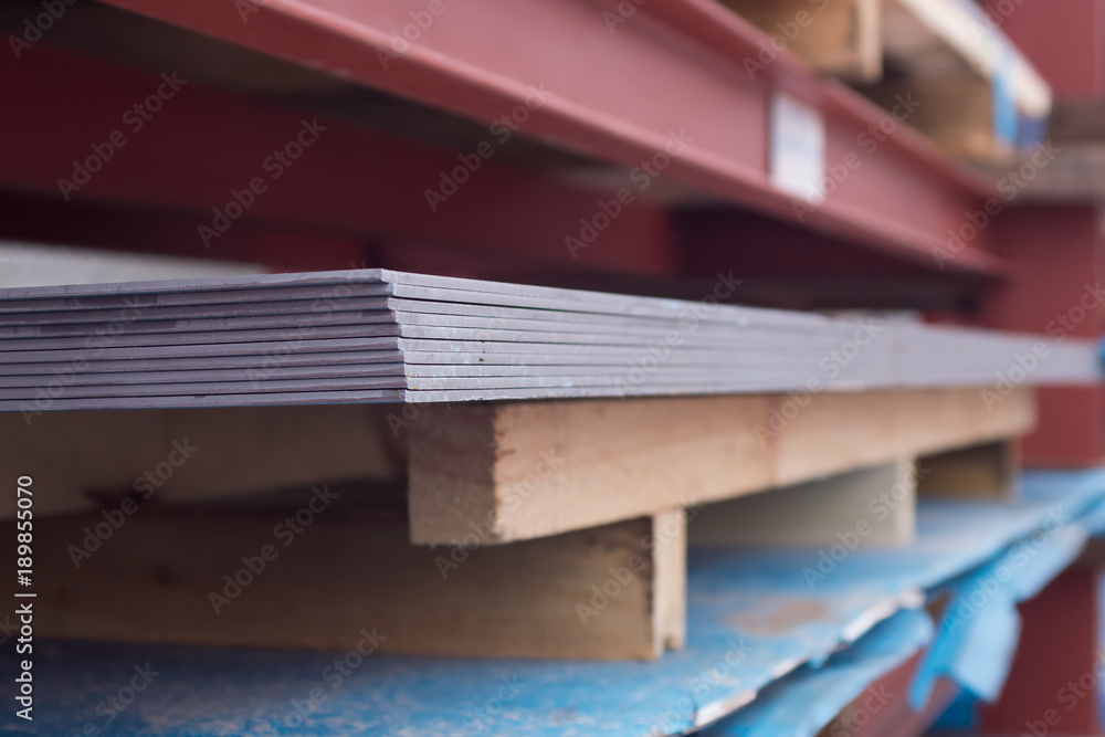 Fototapeta premium Steel plate metal on a red construction. background