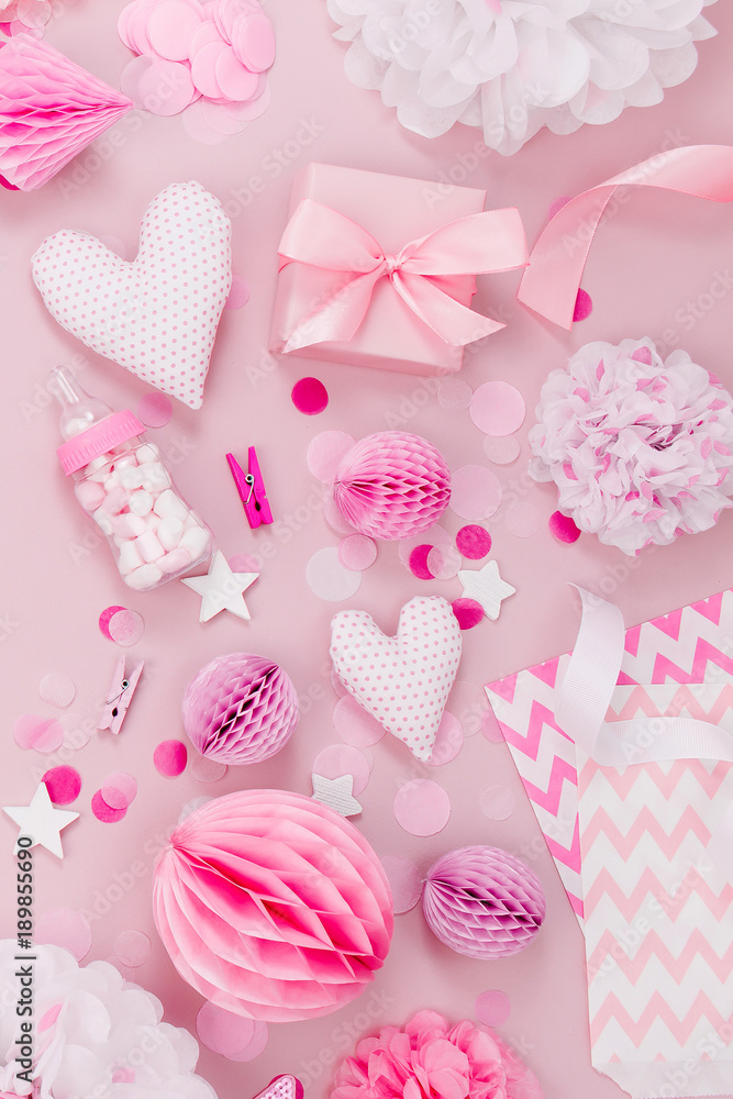 Frame made of Pink and white Paper Decorations, candy, hearts, gifts, confetti for Baby party. Flat lay, top view Frame made of Pink and white Paper Decorations, candy, hearts, gifts, confetti for Baby party. Flat lay, top view
