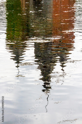 Distorted water reflection of the Commandery Castle at Sint-Pieters-Voeren, Belgium