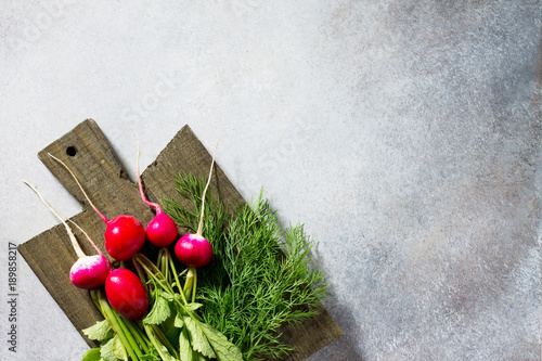 Fresh vegetables and fresh greens on a stone or slate background. Top view with copy space.