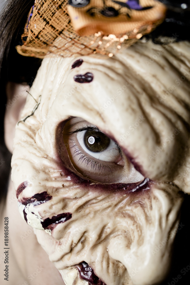 Naklejka premium Zombie woman with dead living mask