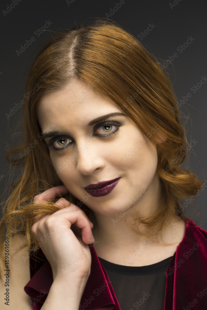 Portrait of a young girl with red hair and green eyes Portrait of a young girl with red hair and green eyes