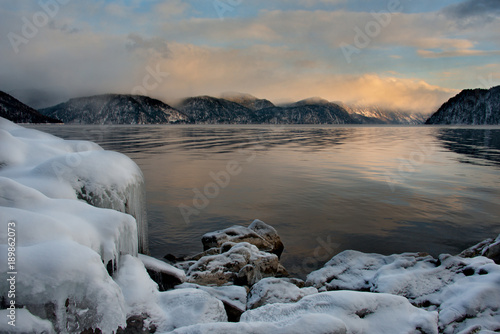 Russia. Mountain Altai. Sunset on lake Teletskoye.