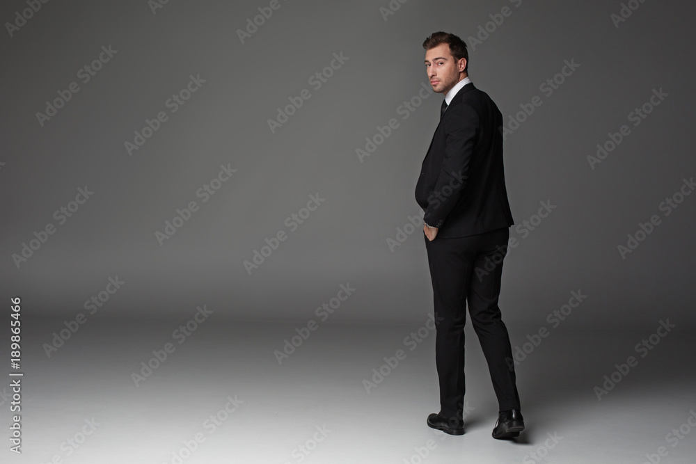 Full length portrait of serene bearded male looking at camera. Occupation concept. Copy space Full length portrait of serene bearded male looking at camera. Occupation concept. Copy space