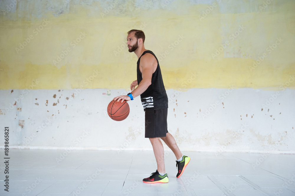 Young man basketball player with ball in hands is prepearing to play. Young man basketball player with ball in hands is prepearing to play.