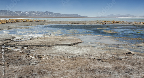 Laguna y Termas de Polques hot spring pool with Salar de Chalviri in background, Salar de Uyuni, Potosi, Bolivia - South America photo