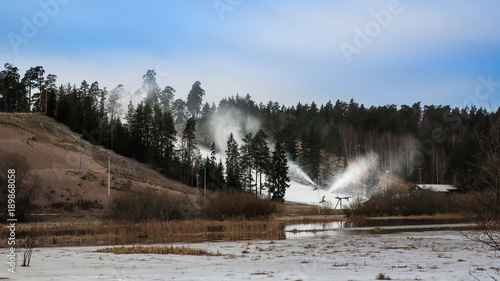 Snow cannons spray snow on ...