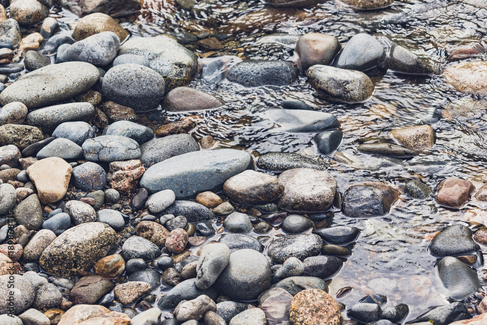 Sand and pebbles. Wave on a river, the sea. Sand and pebbles. Wave on a river, the sea.