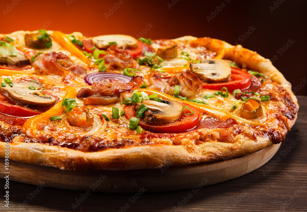 Pizza with salami and mushrooms 