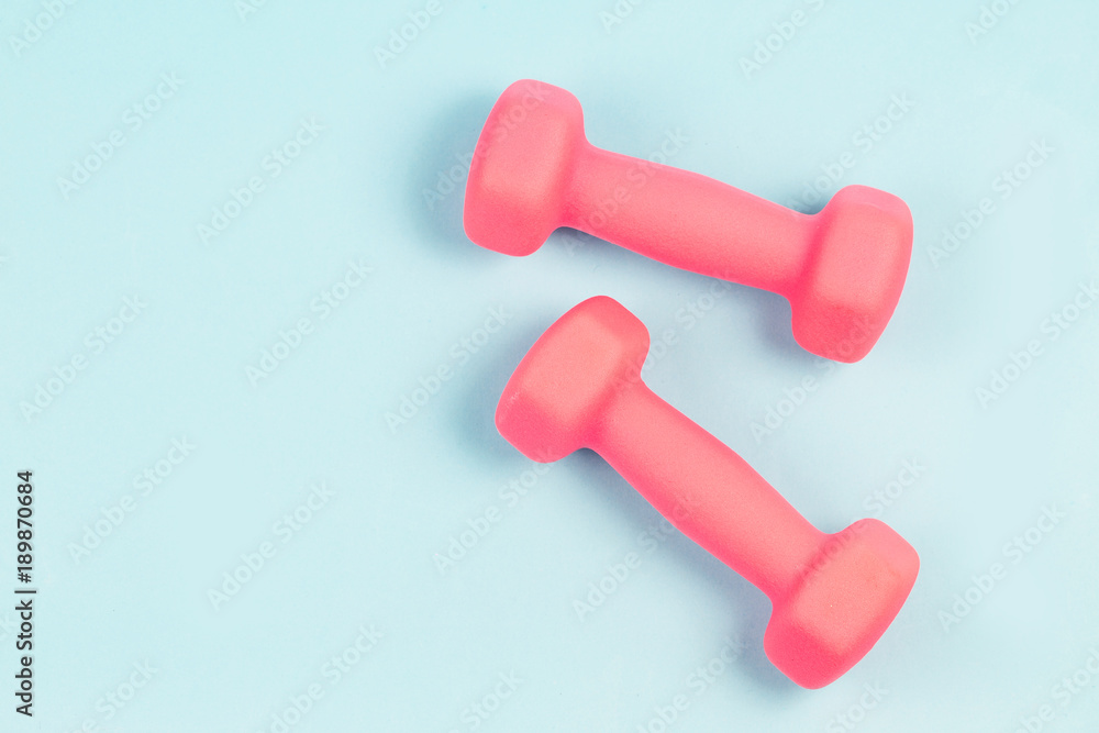 Dumbbell in the blue background Dumbbell in the blue background