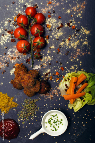 Fried meatballs with vegetables and spices