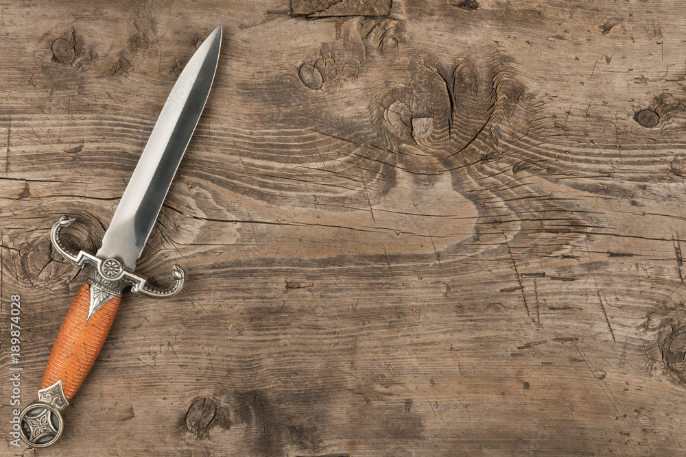 custom made wallpaper toronto digitalKnife, dagger on a wooden surface, with a place for your text.