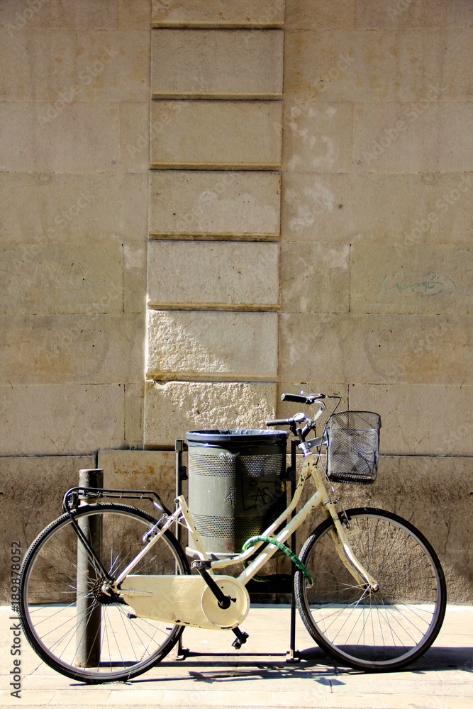 vintage bicycle in front of a stone wall