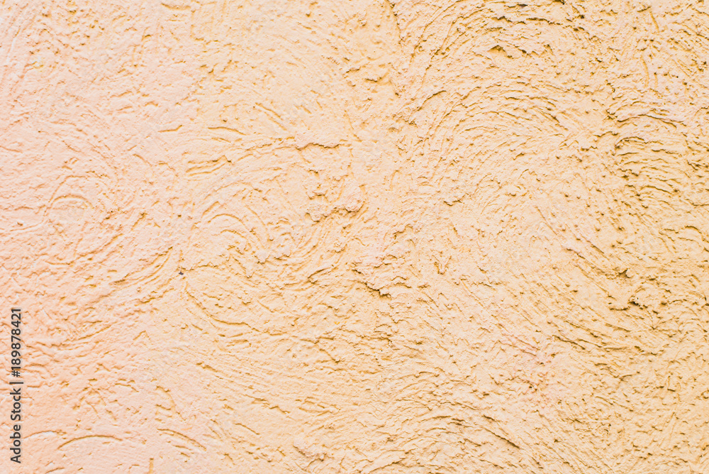 Rough concrete wall painted in beige color - background, texture Rough concrete wall painted in beige color - background, texture