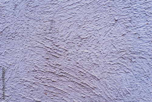 Rough concrete wall painted in gray - background, texture