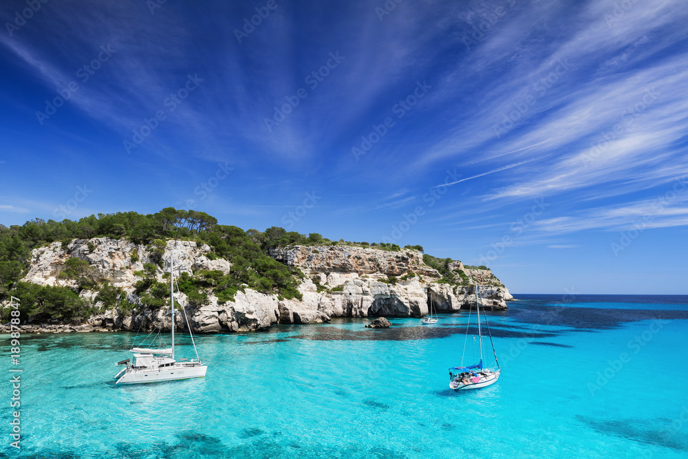 Beautiful bay with sail boats, Menorca island, Spain. Sailing and yachting concept