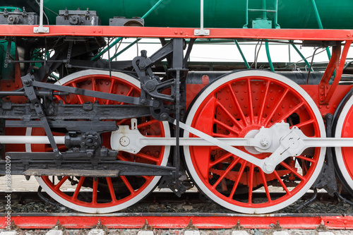 red wheel and detail of mechanism a vintage russian steam train locomotive