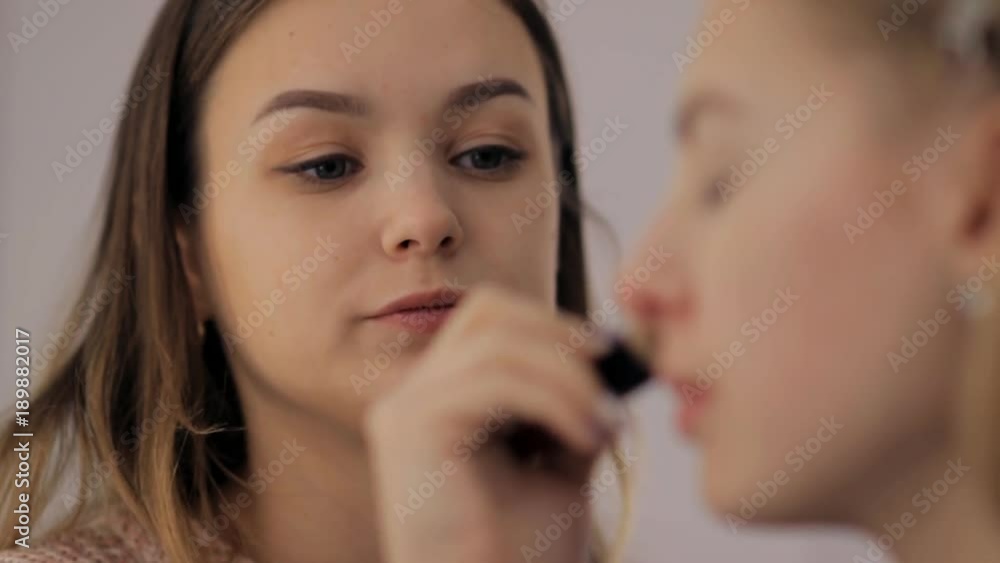 Professional makeup artist and hairstylist creates a beautiful image for a beautiful young girl. Professional makeup artist and hairstylist creates a beautiful image for a beautiful young girl.