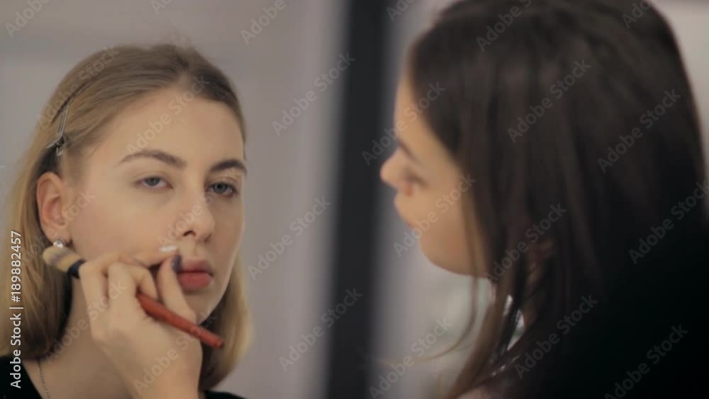 Professional makeup artist and hairstylist creates a beautiful image for a beautiful young girl. Professional makeup artist and hairstylist creates a beautiful image for a beautiful young girl.