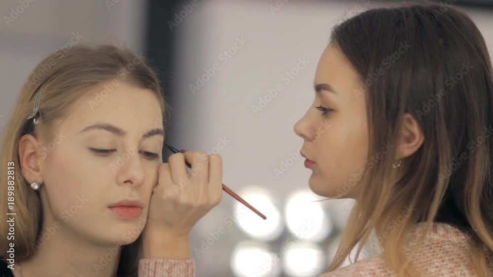 Professional makeup artist and hairstylist creates a beautiful image for a beautiful young girl. Professional makeup artist and hairstylist creates a beautiful image for a beautiful young girl.