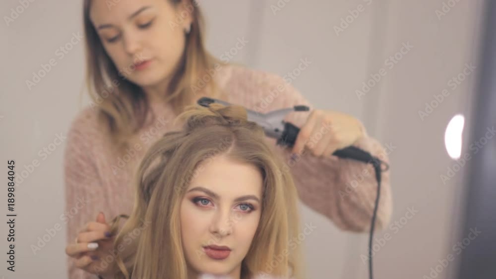 Professional makeup artist and hairstylist creates a beautiful image for a beautiful young girl. Professional makeup artist and hairstylist creates a beautiful image for a beautiful young girl.