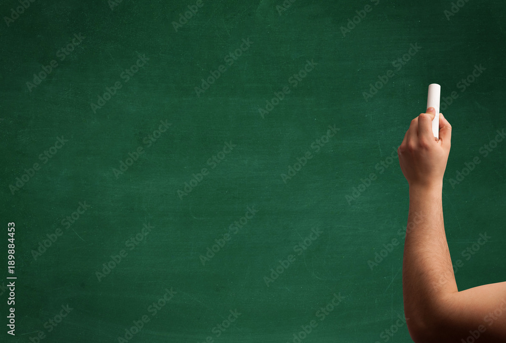 Hand writing on clean blackboard Hand writing on clean blackboard
