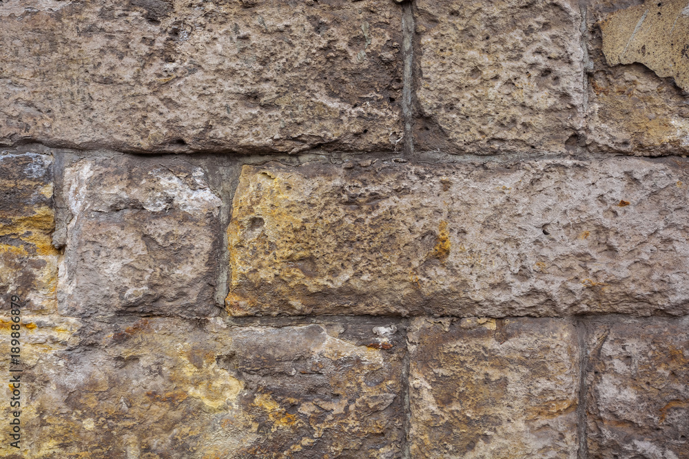 Stone wall background Wall made of cavern rock Stone wall background Wall made of cavern rock