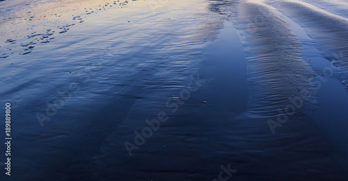 Texture of wet sand beach
