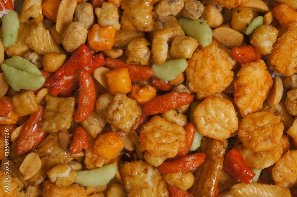 Snacks background with salty crunchy treats, Japanese Otsumami rice cracker snack chip and peanut Snacks background with salty crunchy treats, Japanese Otsumami rice cracker snack chip and peanut