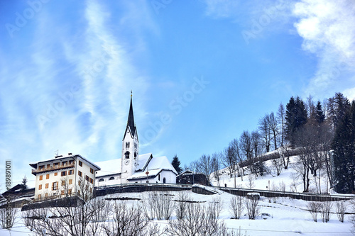 Falcade, Italy, Trentino Alto Adige .Church of San Sebastiano. Winter, snow. Catholic Church.