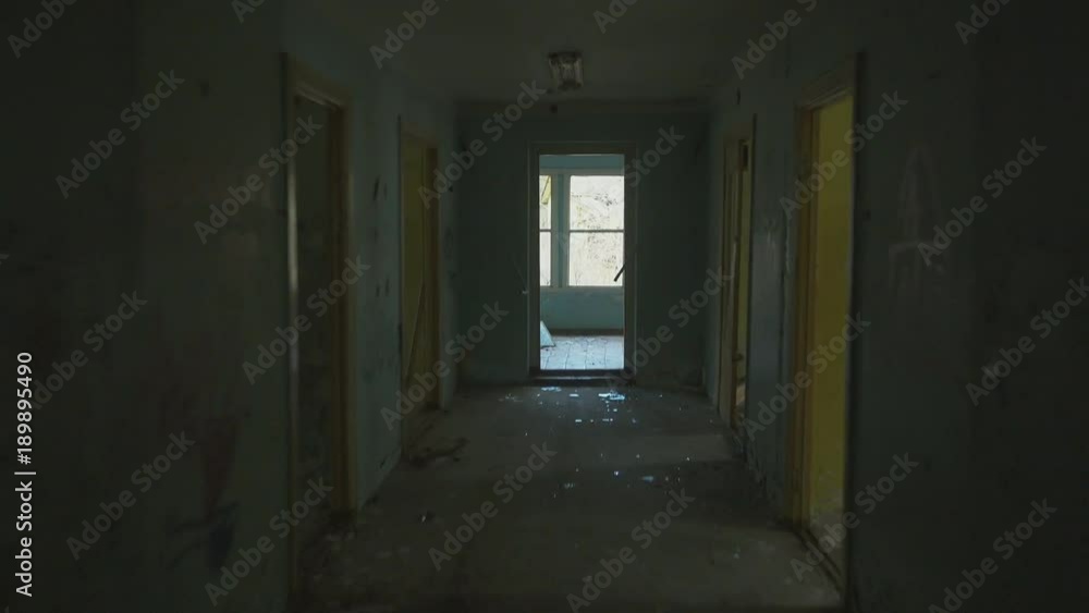 Fast running forward in corridor inside abandoned building Fast running forward in corridor inside abandoned building