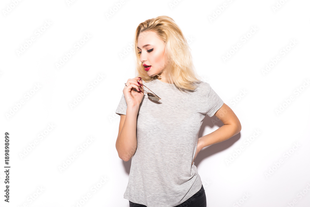 portrait of beautiful blonde girl looking over her sunglasses isolated on white background portrait of beautiful blonde girl looking over her sunglasses isolated on white background