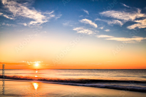 Beautiful meditating Atlantic Ocean sunrise with waves.