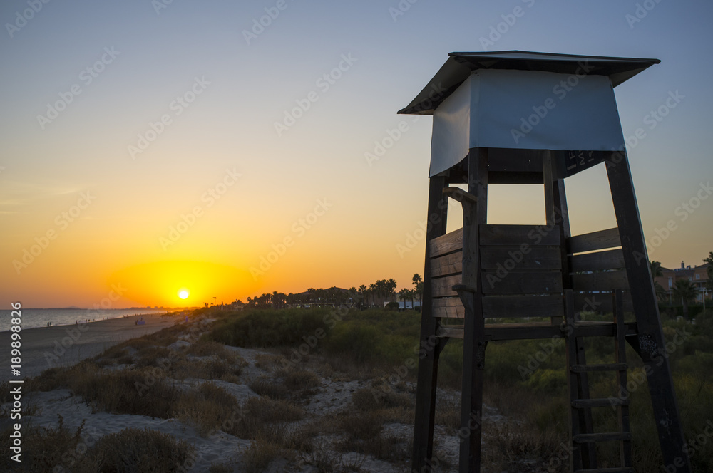 Life guard tower at sunset close to Islantilla beach
