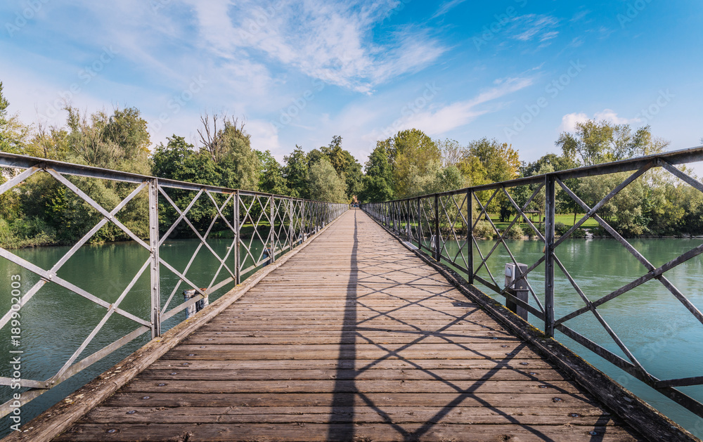 Pedestrian bridge crossing River Adda in Italy