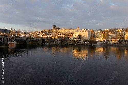 Snowy Prague Lesser Town with gothic Castle in the rising sun  Czech republic