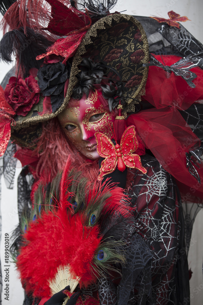 Colourful venetian masks and costumes worn to the Venice Carnival