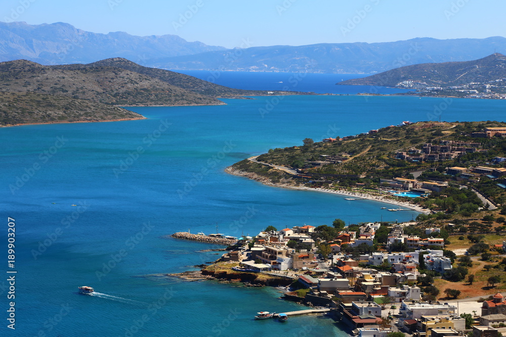 Part of the eastern cretan coast (Greece) near Elounda, panorama of part of the city and the ocean in Crete.