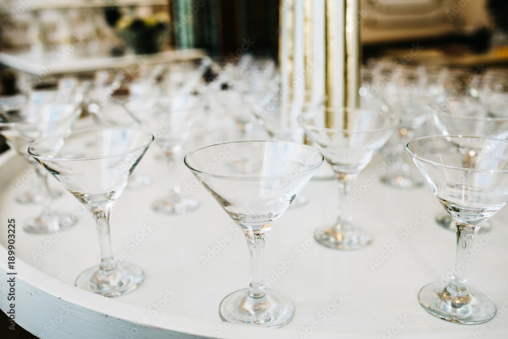 Many empty glasses for a wine drying in the bar. Close up photo Many empty glasses for a wine drying in the bar. Close up photo