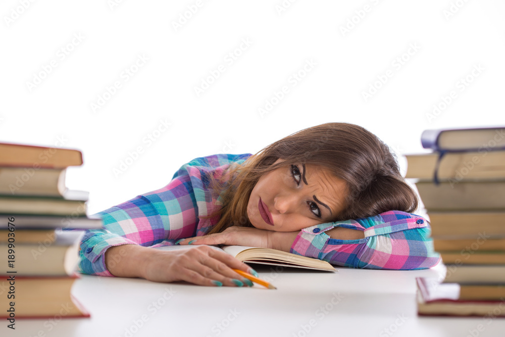 Beautiful young student tired of studying and reading Beautiful young student tired of studying and reading