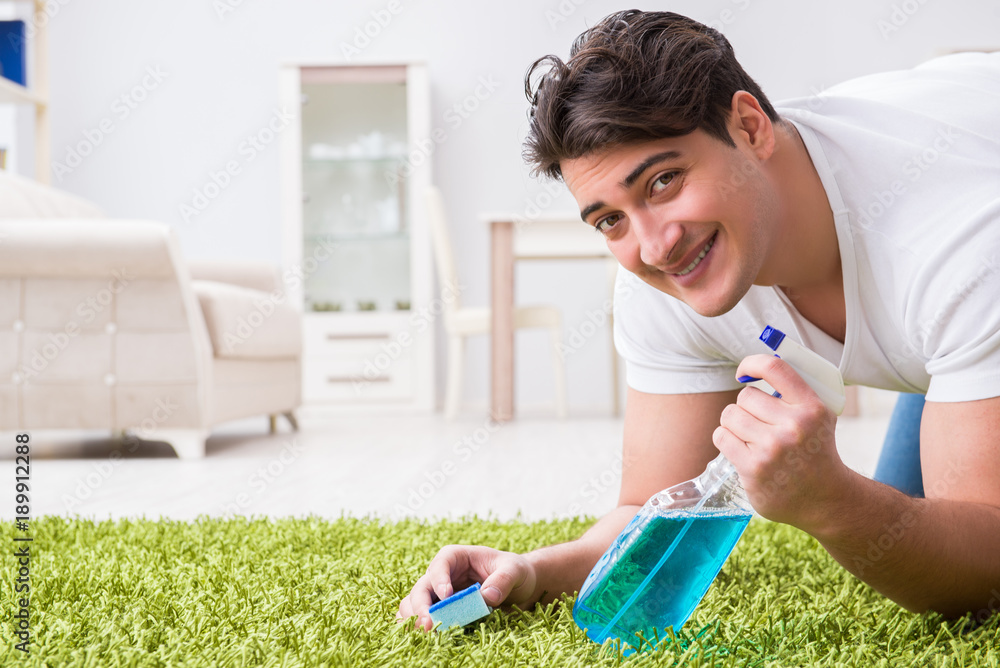 Young husband man cleaning floor at home Young husband man cleaning floor at home