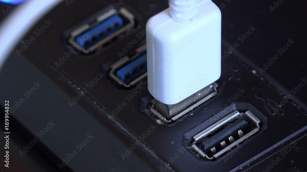 USB wiring being plugged in to black computer USB wiring being plugged in to black computer