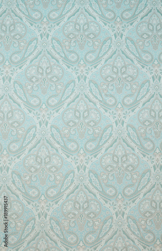Textured Fabric Background with Floral Swirls and Paisley Designs