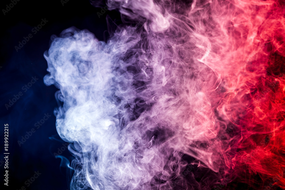 Colorful  red and blue  smoke clouds on dark background.Background of smoke vape