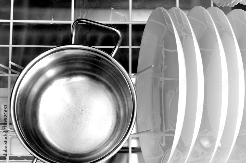 clean dishes and pot in the dishwasher