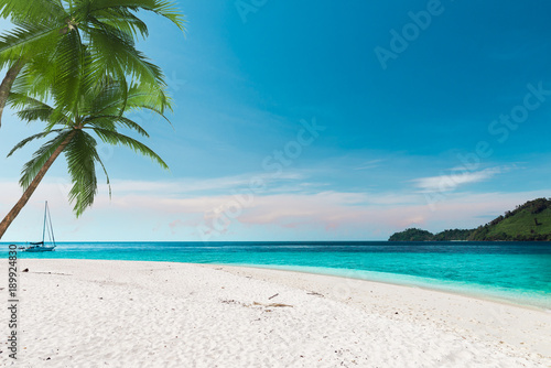 Fototapeta Naklejka Na Ścianę i Meble -  The white sand beach with the blue sky in Thailand