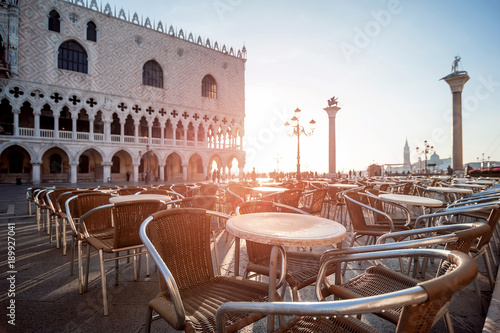 empty cafe in old european city at sunrise. San Marco Square, Venice, Italy